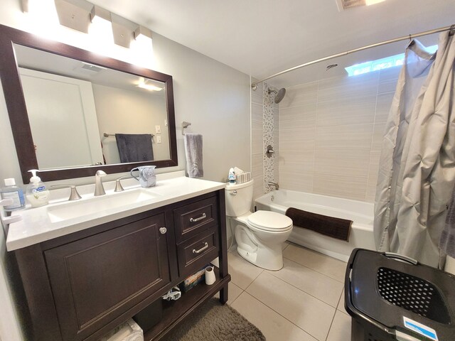 bathroom featuring vanity, toilet, tile patterned floors, shower / tub combo, and visible vents