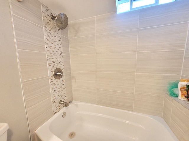 full bath featuring bathtub / shower combination and toilet