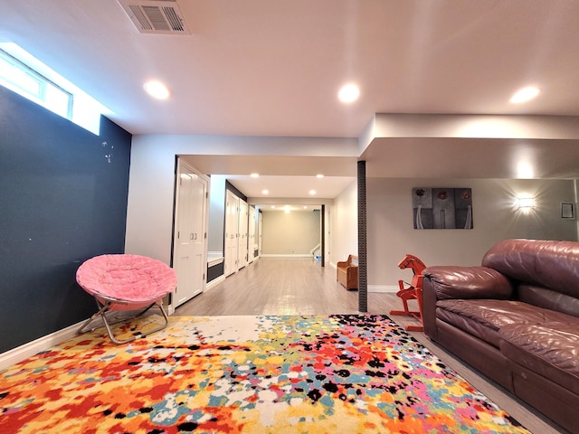 interior space with visible vents, recessed lighting, baseboards, and wood finished floors