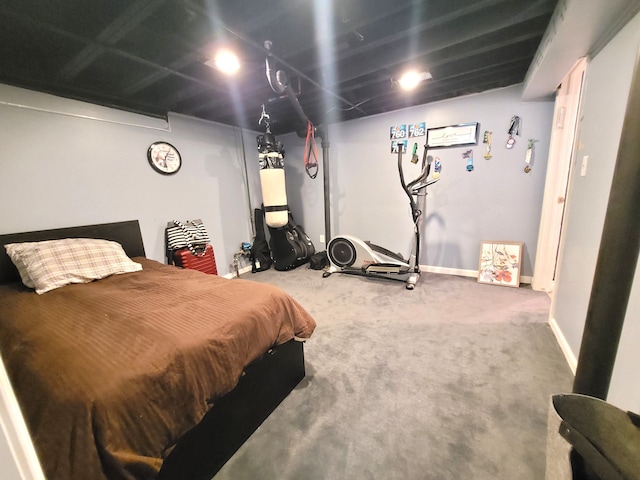 bedroom featuring baseboards and carpet flooring