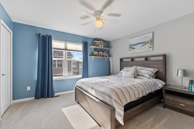bedroom with carpet floors, baseboards, and ceiling fan