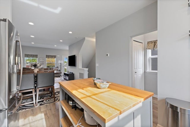dining space featuring recessed lighting and light wood finished floors