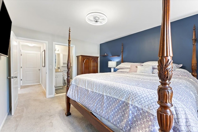 bedroom featuring baseboards and light carpet