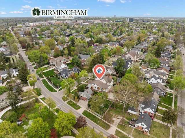 birds eye view of property with a residential view