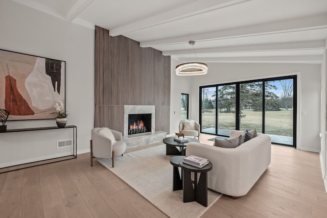 21725 Normandale St, Beverly Hills, MI 48025 - living area with light wood-style flooring, a fireplace, and baseboards