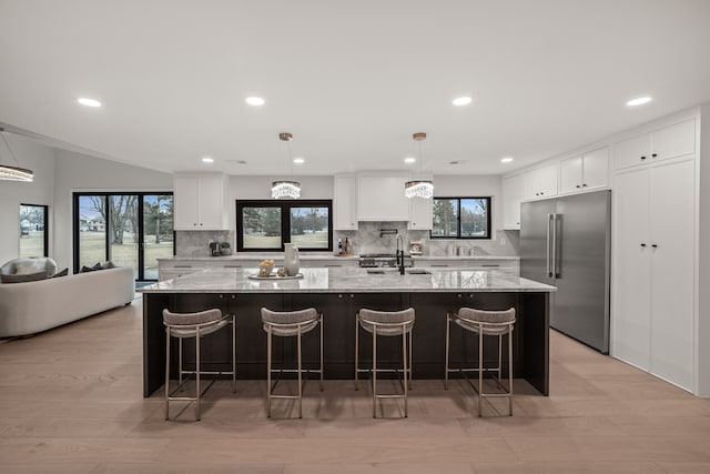 21725 Normandale St, Beverly Hills, MI 48025 - kitchen featuring built in refrigerator, backsplash, white cabinets, plenty of natural light, and recessed lighting