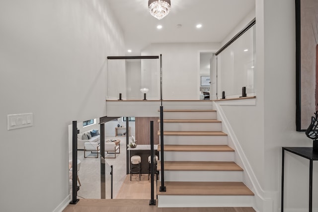 21725 Normandale St, Beverly Hills, MI 48025 - stairway with a chandelier, recessed lighting, and baseboards