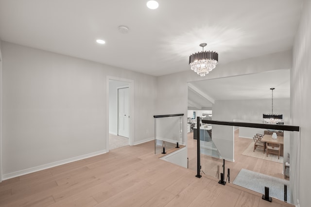 21725 Normandale St, Beverly Hills, MI 48025 - hall featuring a chandelier, an upstairs landing, wood finished floors, recessed lighting, and baseboards