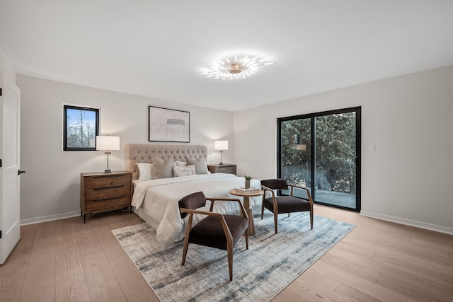 21725 Normandale St, Beverly Hills, MI 48025 - bedroom featuring access to exterior, baseboards, and light wood-type flooring