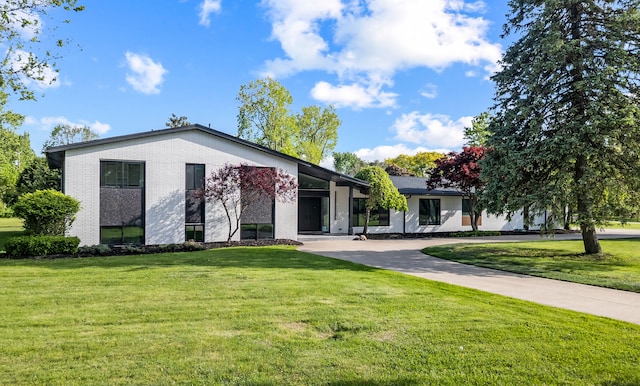 21725 Normandale St, Beverly Hills, MI 48025 - view of front of property featuring brick siding and a front yard