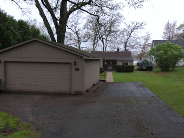 2305 Ridge Rd, White Lake, MI 48383 - ranch-style home with a detached garage, an outdoor structure, and a front yard