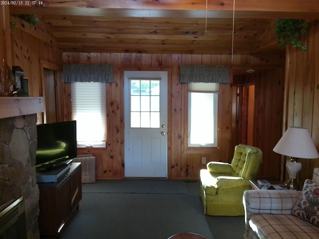 2305 Ridge Rd, White Lake, MI 48383 - living area with healthy amount of natural light, wooden walls, carpet floors, a fireplace, and wood ceiling