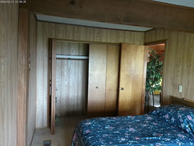 2305 Ridge Rd, White Lake, MI 48383 - carpeted bedroom featuring wood walls and a closet