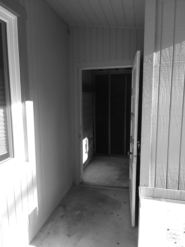 2305 Ridge Rd, White Lake, MI 48383 - hall featuring unfinished concrete floors