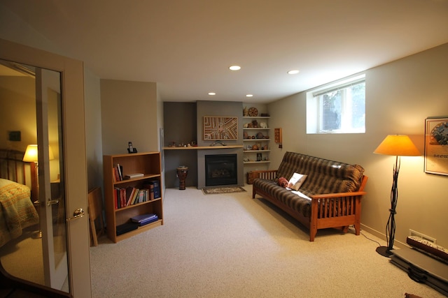 living room with carpet floors, a fireplace, and recessed lighting