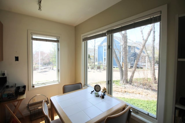 dining area featuring track lighting