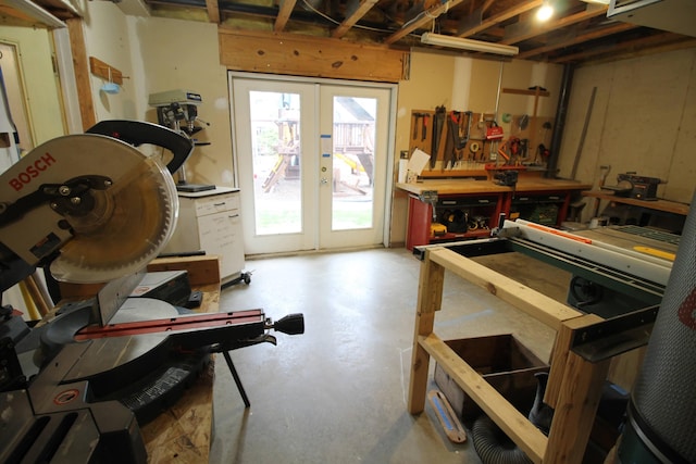 interior space featuring a workshop area and french doors