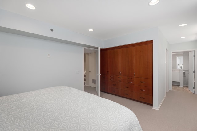 bedroom with light carpet, recessed lighting, and visible vents