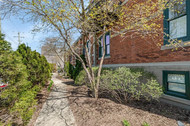 view of home's exterior with brick siding