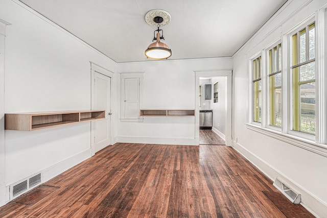 unfurnished dining area with baseboards, visible vents, and dark wood finished floors