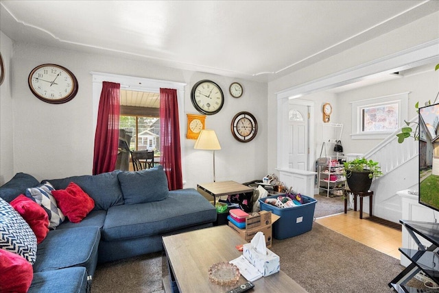 living room featuring stairs