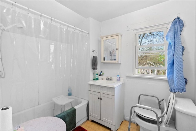 bathroom featuring vanity, toilet, and shower / tub combo with curtain
