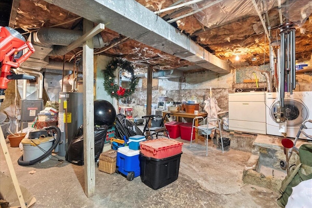 unfinished below grade area featuring separate washer and dryer and gas water heater