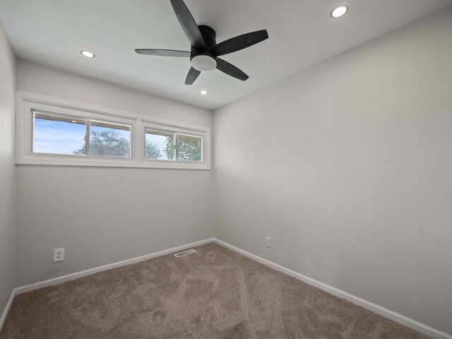 carpeted spare room with recessed lighting, baseboards, visible vents, and ceiling fan