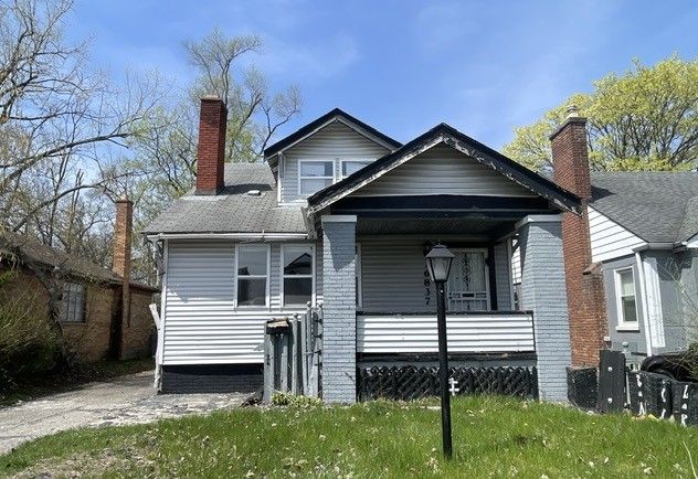 16837 Winthrop St, Detroit, MI 48235 - rear view of house featuring a porch and a chimney