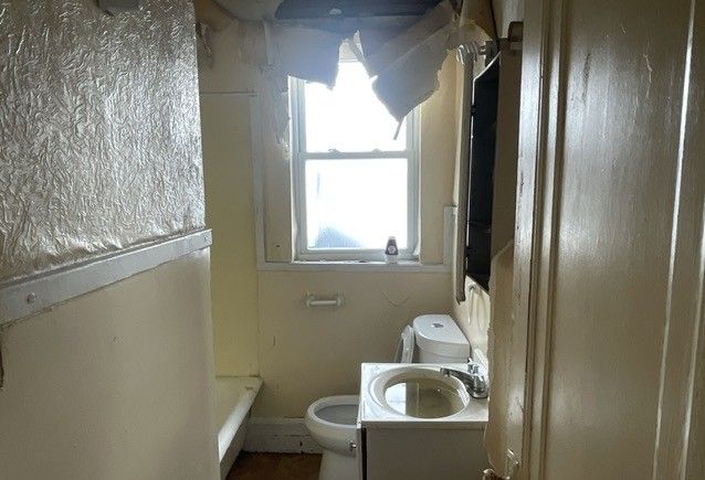 16837 Winthrop St, Detroit, MI 48235 - full bath with vanity, toilet, and a shower