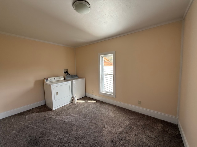 laundry area featuring carpet floors, laundry area, crown molding, and washer and clothes dryer