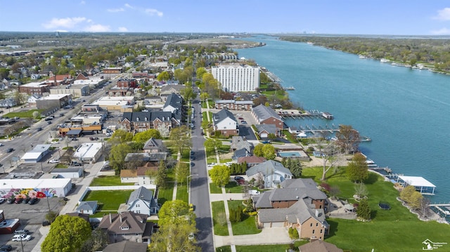 bird's eye view with a water view and a residential view