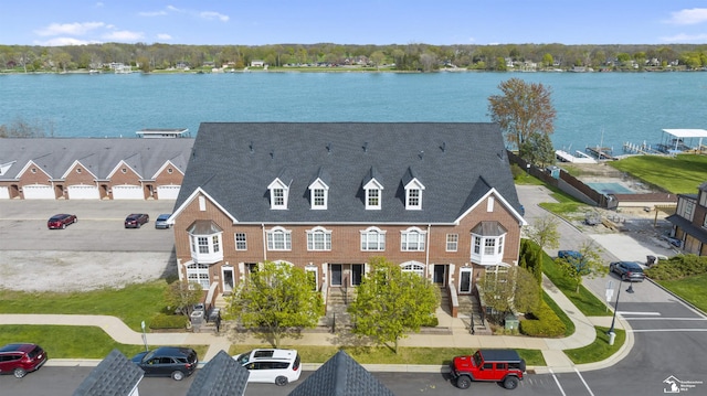 birds eye view of property featuring a water view