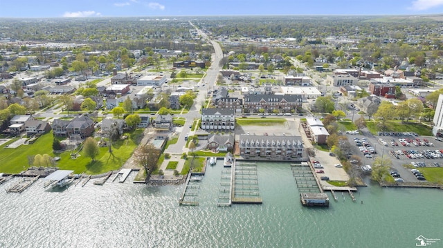 bird's eye view featuring a water view and a residential view