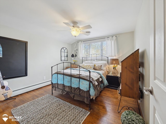 bedroom featuring baseboards, ceiling fan, baseboard heating, and wood finished floors