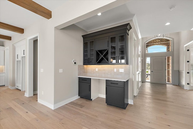 692 Westlake Ave, Oxford, MI 48371 - bar with tasteful backsplash, light wood-type flooring, beam ceiling, baseboards, and recessed lighting