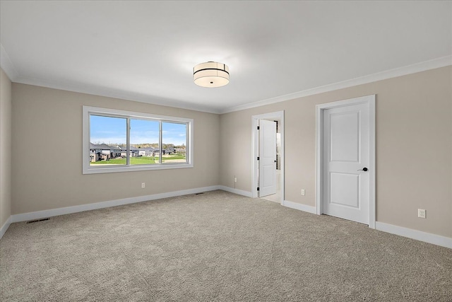 692 Westlake Ave, Oxford, MI 48371 - empty room featuring baseboards, visible vents, and ornamental molding