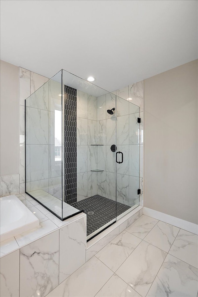 692 Westlake Ave, Oxford, MI 48371 - bathroom featuring a bath, a shower stall, baseboards, marble finish floor, and recessed lighting
