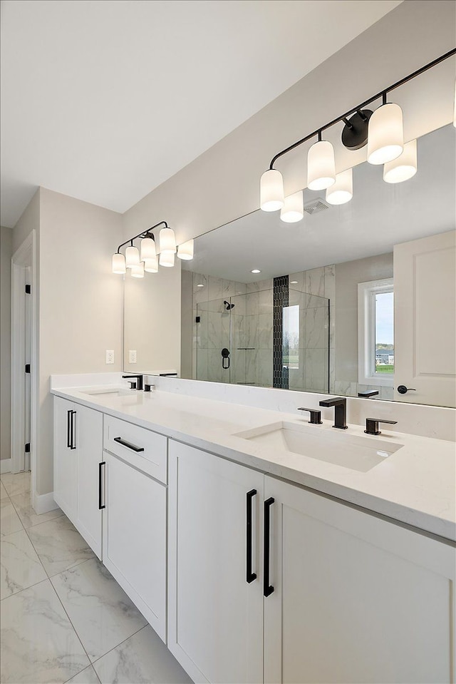 692 Westlake Ave, Oxford, MI 48371 - bathroom with double vanity, a shower stall, a sink, and marble finish floor