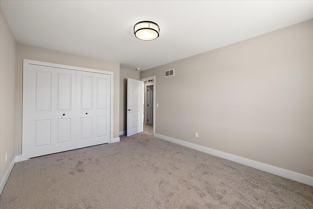 692 Westlake Ave, Oxford, MI 48371 - unfurnished bedroom featuring visible vents, carpet flooring, baseboards, and a closet