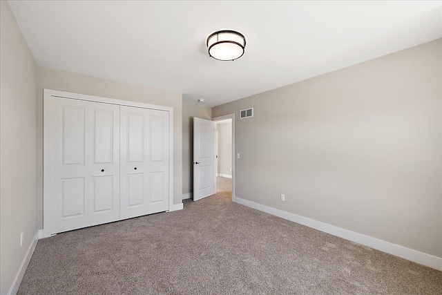 692 Westlake Ave, Oxford, MI 48371 - unfurnished bedroom featuring carpet floors, baseboards, visible vents, and a closet