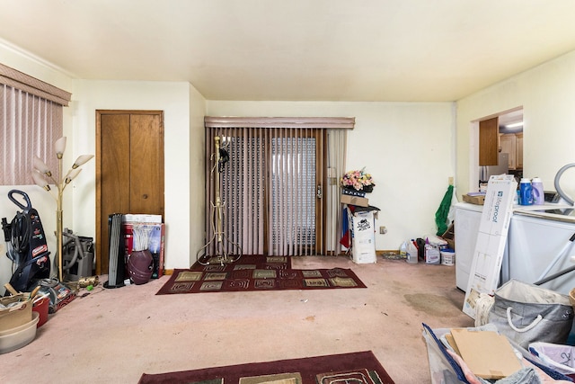 doorway to property featuring washer / dryer