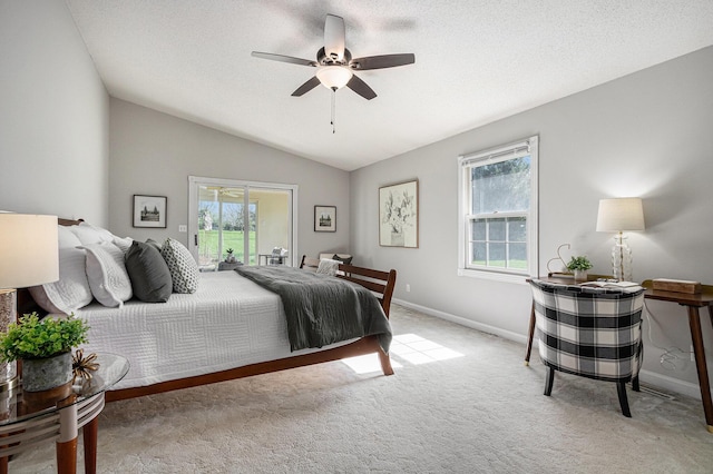 carpeted bedroom with access to outside, baseboards, vaulted ceiling, and a ceiling fan