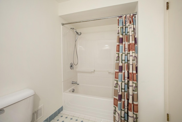 bathroom featuring shower / bath combo, tile patterned flooring, toilet, baseboards, and visible vents