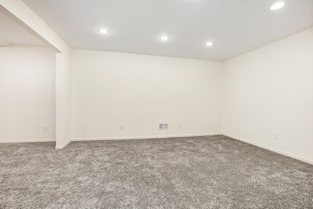 finished below grade area with carpet flooring, recessed lighting, and baseboards