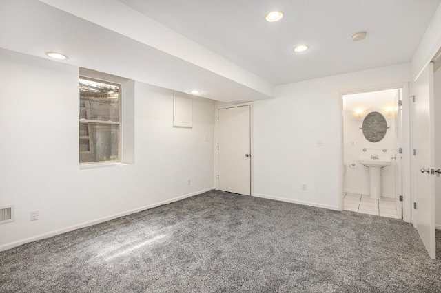 unfurnished bedroom with carpet flooring, connected bathroom, recessed lighting, baseboards, and visible vents