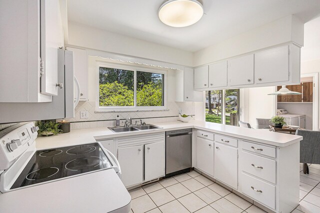 3606 Chatham Way, Ann Arbor, MI 48105 - kitchen featuring decorative backsplash, light countertops, a sink, a peninsula, and white appliances