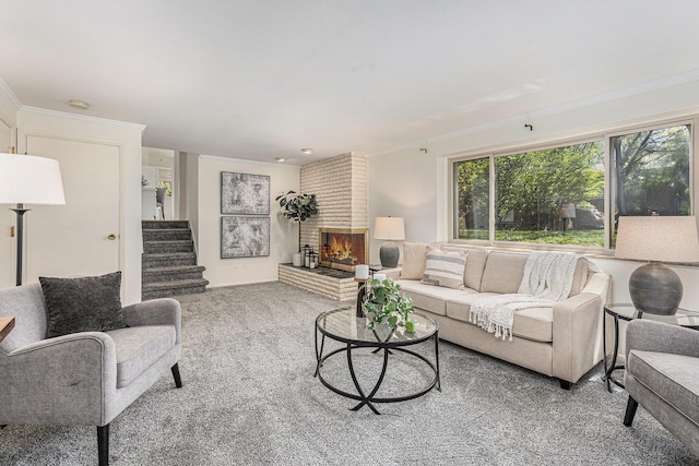 living room featuring crown molding, carpet, stairs, and a fireplace