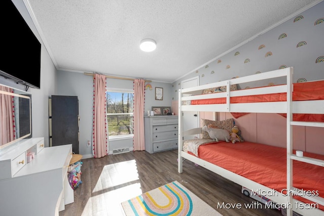 bedroom with crown molding, a textured ceiling, visible vents, and wood finished floors