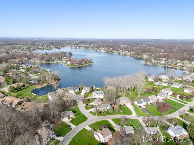 aerial view with a residential view and a water view